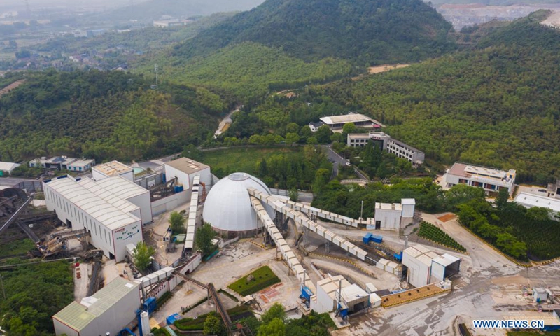 Aerial photo taken on May 8, 2021 shows leakproof workshops and conveyors at a construction material company in Donglin Township, Wuxing District of Huzhou City, east China's Zhejiang Province. Donglin Township has engaged all local residents in protecting the ecological environment by reducing pollutants such as floating dusts from the source.Photo:Xinhua