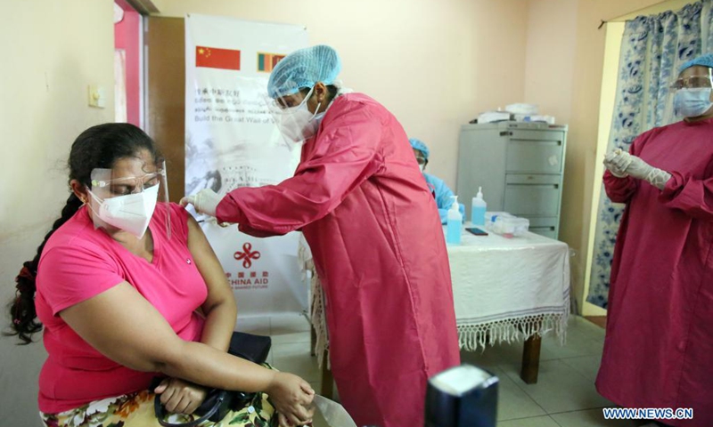 A woman receives the Sinopharm vaccine at the Panadura Health Office in Kalutara District, in the outskirts of capital Colombo, Sri Lanka, on May 8, 2021. Sri Lanka's Health Ministry on Saturday began administering the Sinopharm vaccine to local nationals, soon after the World Health Organization (WHO) approved it for emergency use worldwide.(Photo: Xinhua)