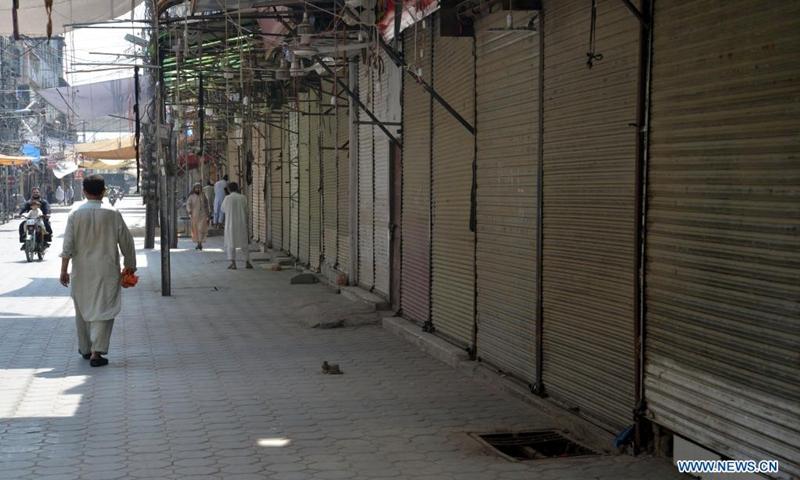 A closed market is seen in northwest Pakistan's Peshawar on May 8, 2021. In its efforts to curb the third wave of COVID-19, the Pakistani government has ramped up restriction across the country for the upcoming holidays of Eid al-Fitr festival, urging the public to stay at home to keep themselves and their loved ones safe.(Photo: Xinhua)