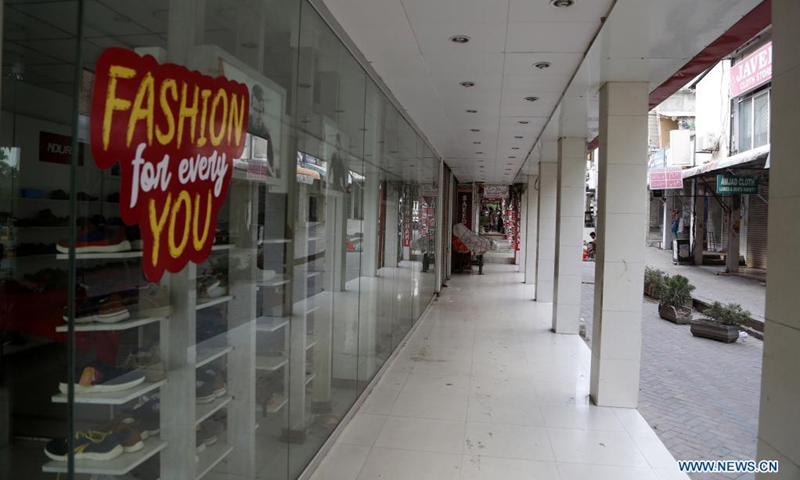 Closed shops are seen at a market in Islamabad, capital of Pakistan, on May 8, 2021. In its efforts to curb the third wave of COVID-19, the Pakistani government has ramped up restriction across the country for the upcoming holidays of Eid al-Fitr festival, urging the public to stay at home to keep themselves and their loved ones safe.(Photo: Xinhua)