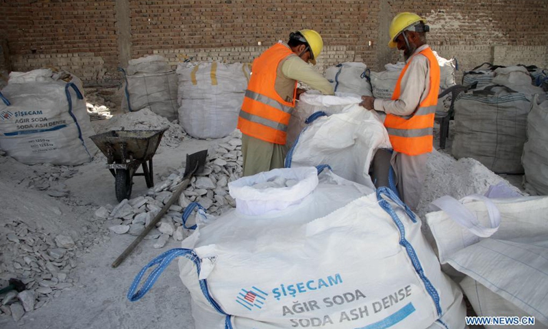 Afghan employees work at a talc stone processing factory in Sorkh Road district of Nangarhar province, Afghanistan, on May 9, 2021. Afghanistan has resumed the export of talc stone from a key mine in the country's eastern province of Nangarhar, the Ministry of Industry and Commerce said on Sunday.(Photo: Xinhua)
