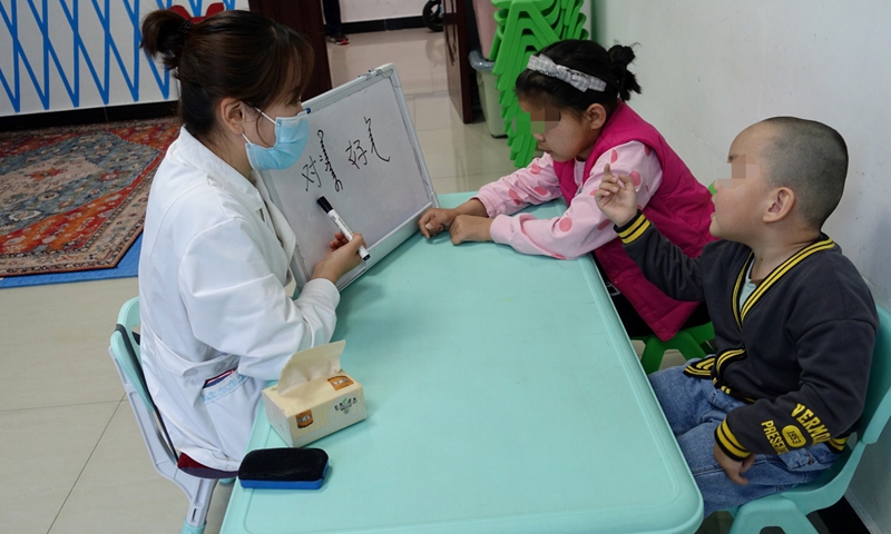 Children with intellectual disabilities and autism are  having a Mongolian language lesson at Mongolian Medicine department of Rehabilitation and Health Care Hospital in Tongliao. Photo: Lin Xiaoyi