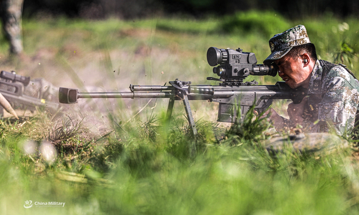 Snipers assigned to a brigade under the PLA 72nd Group Army aim their sniper rifles at targets during a live fire assessment on April 26, 2021.Photo:China Military