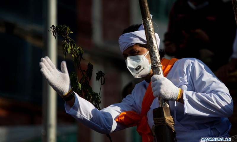 A Nepalese priest is pictured during Rato Machendranath festival amid the COVID-19 pandemic in Lalitpur, Nepal, on May 15, 2021.(Photo: Xinhua)
