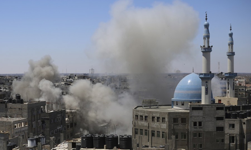 Smoke billows following an Israeli airstrike on a house are seen in the southern Gaza Strip city of Rafah, May 15, 2021.(Photo: Xinhua)