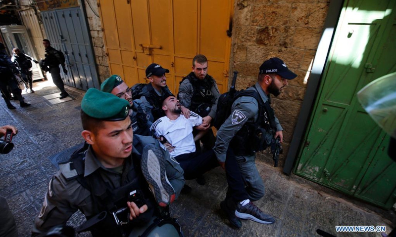 Israeli police arrest a Palestinian during a protest in Jerusalem's Old City, on May 18, 2021.(Photo:Xinhua)