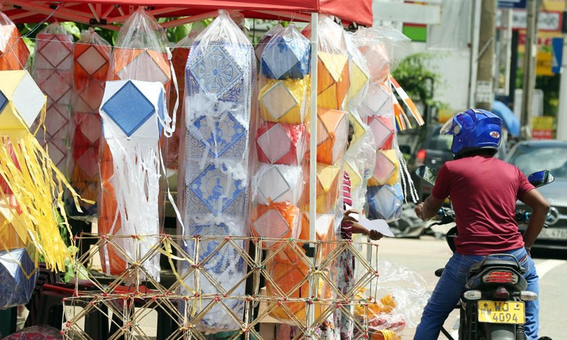 A man looks at lanterns ahead of the Vesak festival in Colombo, Sri Lanka, on May 19, 2021. The Vesak Festival is one of the holiest festivals celebrated in Sri Lanka as it marks the birth, enlightenment and demise of Lord Buddha.Photo:Xinhua