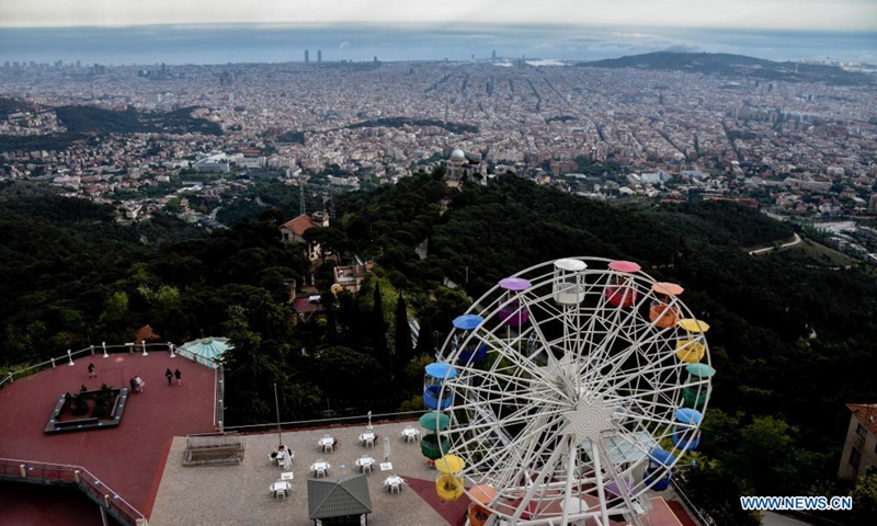 A ferris wheel is seen at Tibidabo Amusement Park in Barcelona, Spain, May 20, 2021. Tibidabo Amusement Park reopened to the public on May 15 after being closed for a year due to the COVID-19 pandemic.Photo:Xinhua