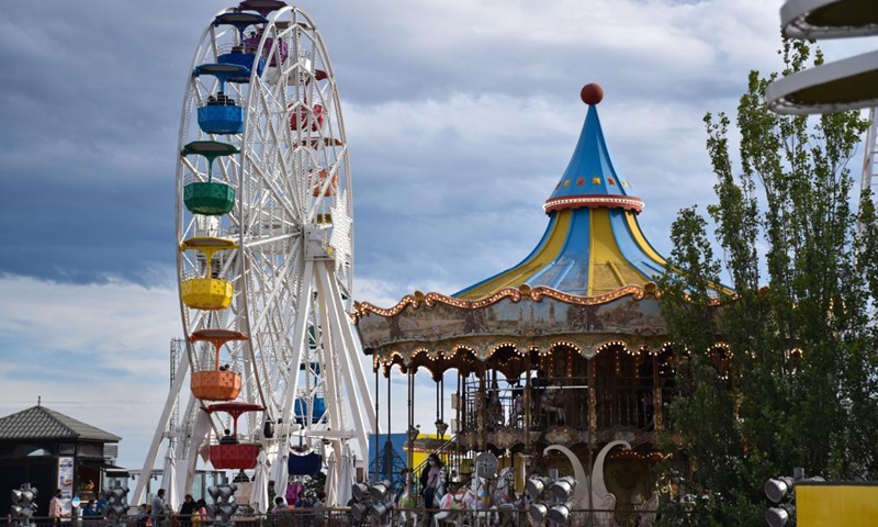 People spend time at Tibidabo Amusement Park in Barcelona, Spain, May 20, 2021. Tibidabo Amusement Park reopened to the public on May 15 after being closed for a year due to the COVID-19 pandemic.Photo:Xinhua