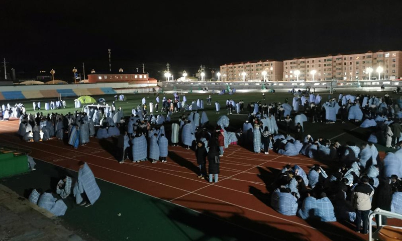 Students of a high school take refuge on the playground in Maqin County of Golog Tibetan Autonomous Prefecture, northwest China's Qinghai Province, May 22, 2021. A 7.4-magnitude earthquake hit Maduo County of Golog Tibetan Autonomous Prefecture, northwest China's Qinghai Province at 2:04 a.m. Saturday Beijing Time, according to the China Earthquake Networks Center.Photo:Xinhua