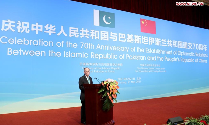 Chinese Vice President Wang Qishan attends a reception marking the 70th anniversary of the establishment of diplomatic ties between China and Pakistan and meets with Pakistani Ambassador to China Moin ul Haque in Beijing, capital of China, May 21, 2021. Photo:Xinhua