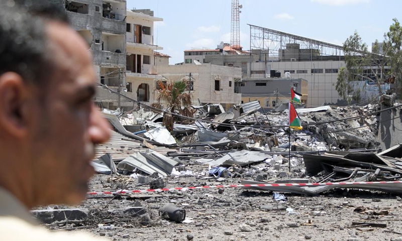 A Palestinian man inspects the damage of a governmental building attacked by Israeli airstrikes in Gaza city, on May 22, 2021. Photo:Xinhua