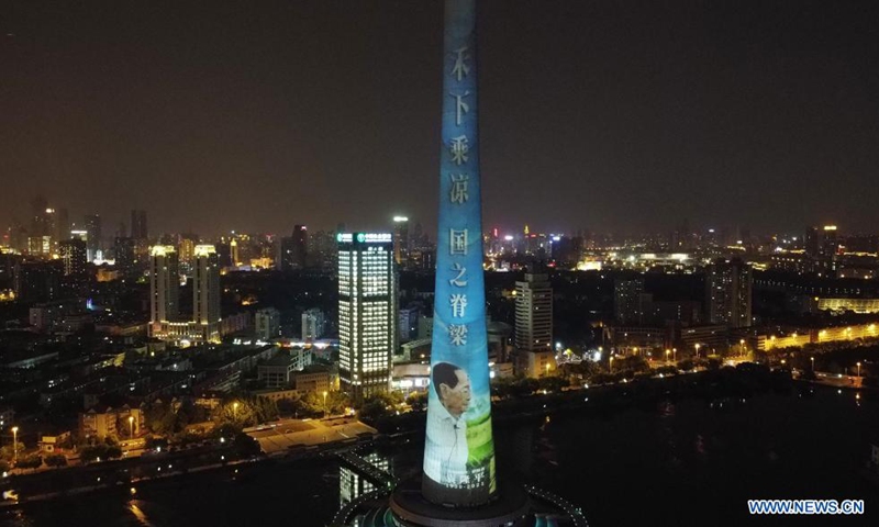 A landmark is lit up in remembrance of Yuan Longping in north China's Tianjin, May 22, 2021. Chinese scientist Yuan Longping, renowned for developing the first hybrid rice strain that relieved countless people of hunger, died of organ failure at 91 on Saturday.(Photo: Xinhua)