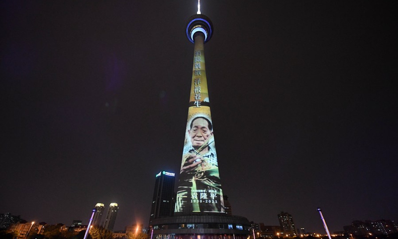 A landmark is lit up in remembrance of Yuan Longping in north China's Tianjin, May 22, 2021.(Photo: Xinhua)
