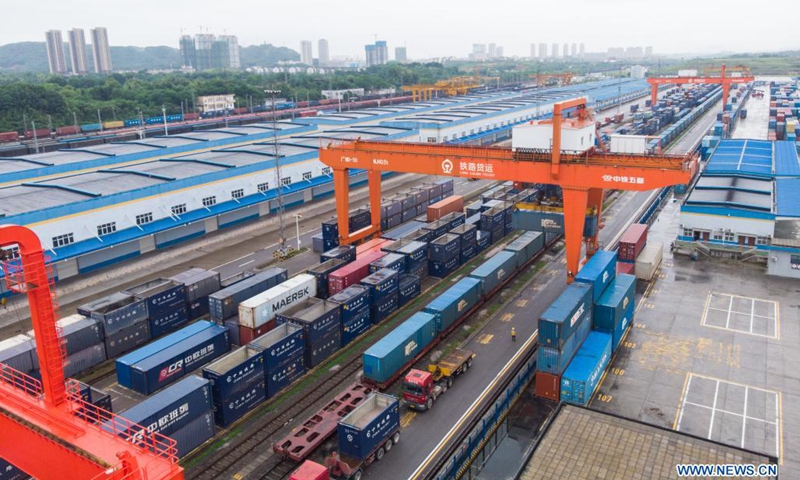 Aerial photo taken on May 22, 2021 shows cargo containers at Changsha north railway station in Changsha, central China's Hunan Province. Train X8426 left Changsha to Minsk on Saturday, carrying machinery parts, textiles, electronic products and other goods from Hunan and neighboring provinces. Over 1,200 freight train trips from Hunan to Europe have been made since October 2014.(Photo: Xinhua)