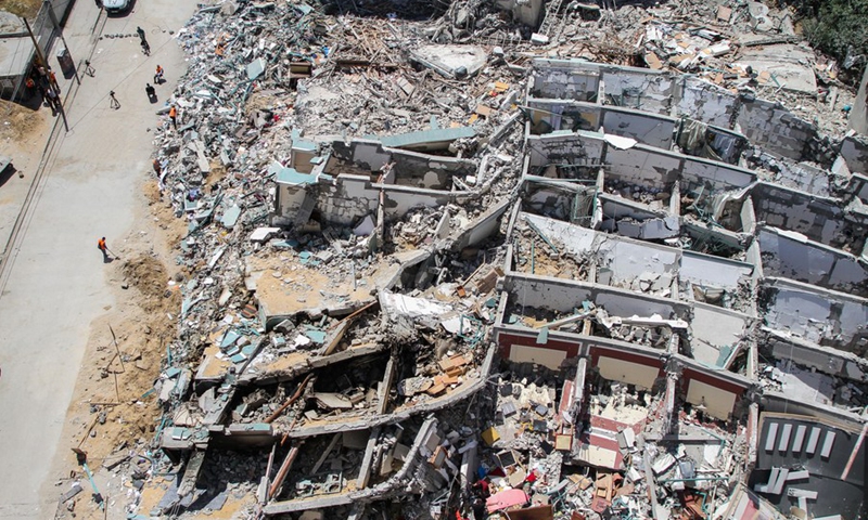 Photo taken on May 23, 2021 shows an overview of the rubble of Jala Tower destroyed during an Israeli air strike in Gaza City. (Photo: Xinhua)