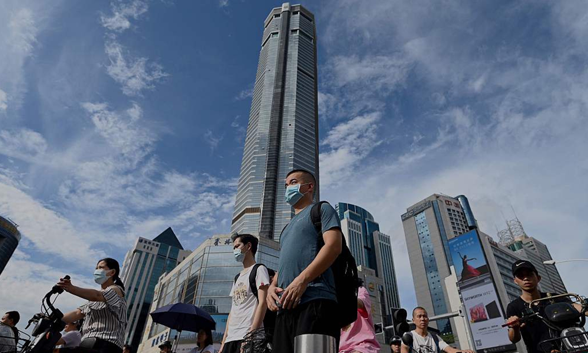 People walk past the temporarily closed 300-meter SEG Plaza in Shenzhen, South China's Guangdong Province on May 24, 2021. Photo: CFP