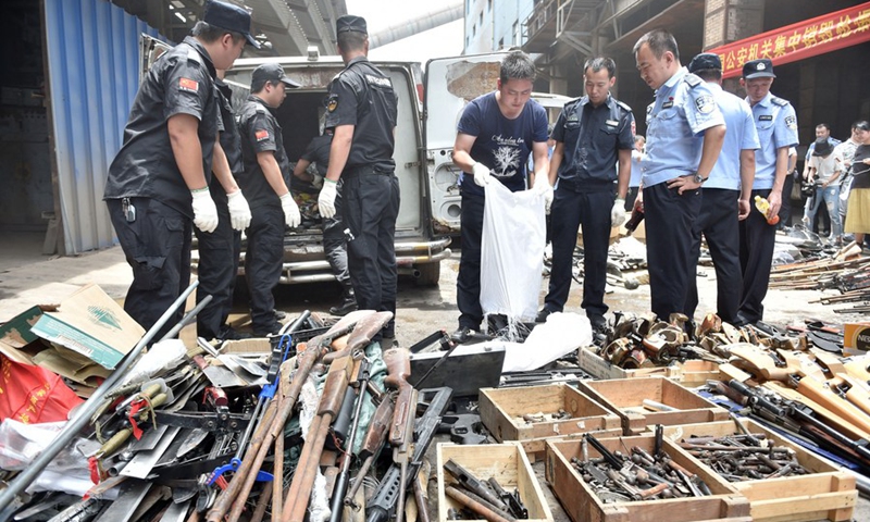 Policemen prepare for the destruction of confiscated illegal arms in Fuzhou, capital of southeast China's Fujian Province, July 5, 2017.(Photo: Xinhua)
