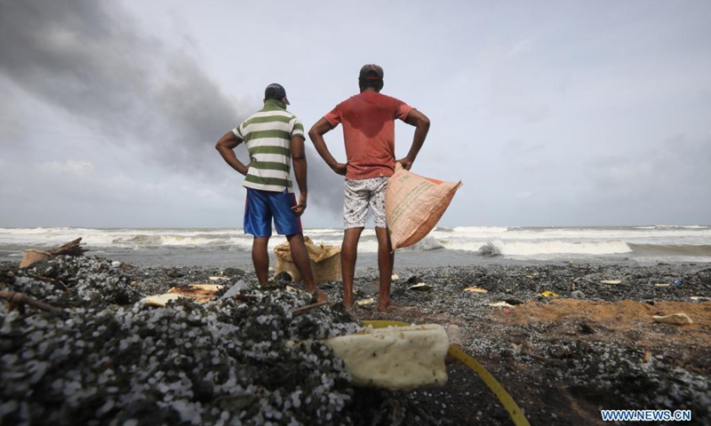 Pieces of items from the burning foreign ship X-Press Pearl are seen washed to the shore of Kapungoda, outskirts of Colombo, Sri Lanka, May 26, 2021. Sri Lankan authorities said on Wednesday it is monitoring an oil spill from a burning foreign vessel near the Port of Colombo, warning that the oil spill may waft towards the Negombo lagoon in the west coast of the country. (Photo: Xinhua)