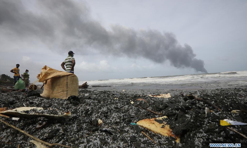Pieces of items from the burning foreign ship X-Press Pearl are seen washed to the shore of Kapungoda, outskirts of Colombo, Sri Lanka, May 26, 2021. Sri Lankan authorities said on Wednesday it is monitoring an oil spill from a burning foreign vessel near the Port of Colombo, warning that the oil spill may waft towards the Negombo lagoon in the west coast of the country.(Photo: Xinhua)