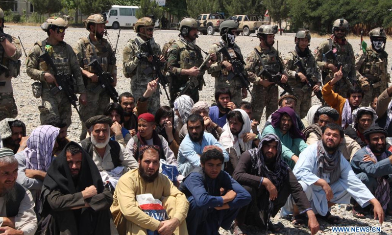 Photo taken in Kunduz city, Afghanistan on May 26, 2021 shows people who were rescued by Afghan Special Forces from a Taliban detention center located in neighboring Baghlan province. A total of 62 hostages including 36 security personnel have been set free after the Afghan Special Forces stormed a Taliban detention center in northern Baghlan province on Wednesday, an army statement said.(Photo: Xinhua)