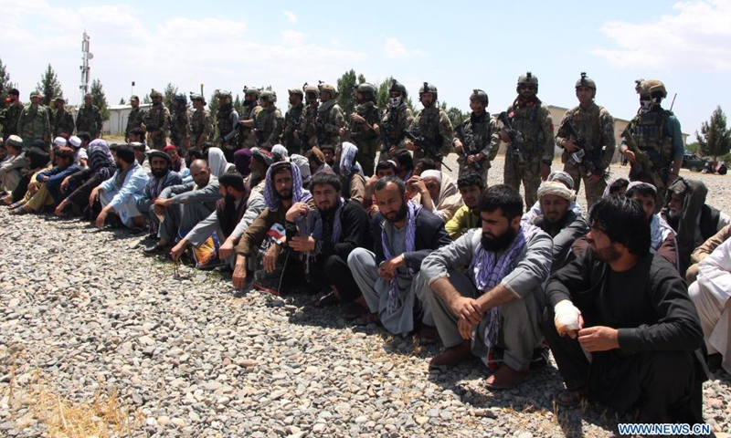 Photo taken in Kunduz city, Afghanistan on May 26, 2021 shows people who were rescued by Afghan Special Forces from a Taliban detention center located in neighboring Baghlan province. A total of 62 hostages including 36 security personnel have been set free after the Afghan Special Forces stormed a Taliban detention center in northern Baghlan province on Wednesday, an army statement said.(Photo: Xinhua)