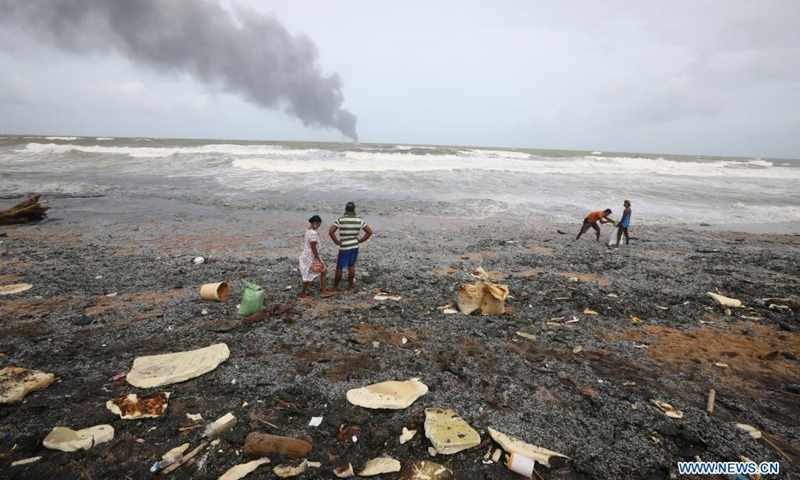 Pieces of items from the burning foreign ship X-Press Pearl are seen washed to the shore of Kapungoda, outskirts of Colombo, Sri Lanka, May 26, 2021. Sri Lankan authorities said on Wednesday it is monitoring an oil spill from a burning foreign vessel near the Port of Colombo, warning that the oil spill may waft towards the Negombo lagoon in the west coast of the country.(Photo: Xinhua)