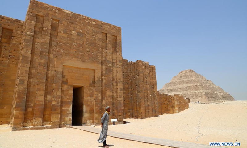 A man visits the Step Pyramid complex in the Saqqara necropolis near the capital Cairo, Egypt, May 26, 2021. The Step Pyramid, a UNESCO World Heritage Site, was designed and built by the architect Imhotep in the 27th century BC during the Third Dynasty to hold the mummy of Pharaoh Djoser.(Photo: Xinhua)