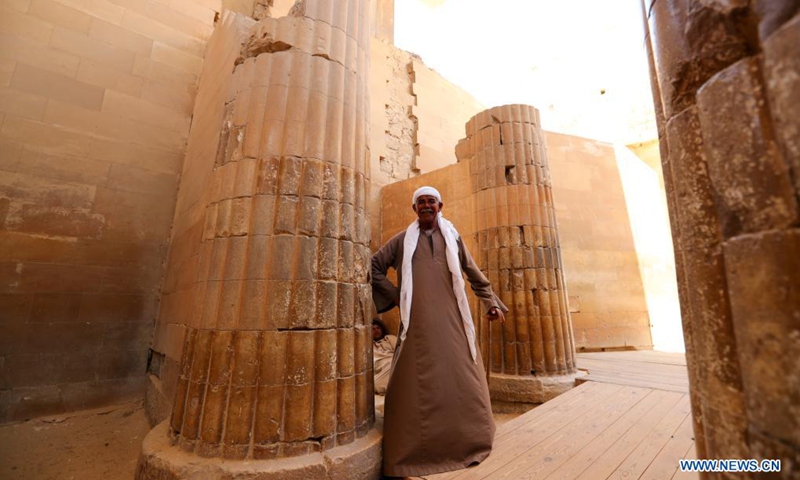 A man is seen at the Step Pyramid complex in the Saqqara necropolis near the capital Cairo, Egypt, May 26, 2021. The Step Pyramid, a UNESCO World Heritage Site, was designed and built by the architect Imhotep in the 27th century BC during the Third Dynasty to hold the mummy of Pharaoh Djoser.(Photo: Xinhua)