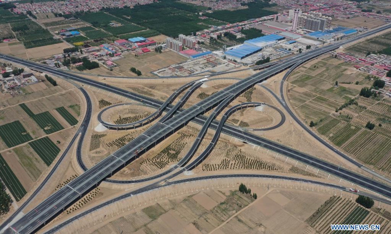 Aerial photo taken on May 10, 2021 shows a junction of the first phase of Beijing-Dezhou expressway and Tianjin-Shijiazhuang expressway in north China's Hebei Province. The Hebei section of Beijing-Xiong'an expressway, the new route of Rongcheng-Wuhai expressway and the first phase of Beijing-Dezhou expressway opened to traffic on Saturday.(Photo: Xinhua)