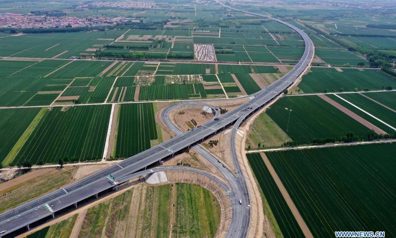 Aerial photo taken on May 10, 2021 shows a view of the first phase of Beijing-Dezhou expressway in north China's Hebei Province. The Hebei section of Beijing-Xiong'an expressway, the new route of Rongcheng-Wuhai expressway and the first phase of Beijing-Dezhou expressway opened to traffic on Saturday.(Photo: Xinhua)