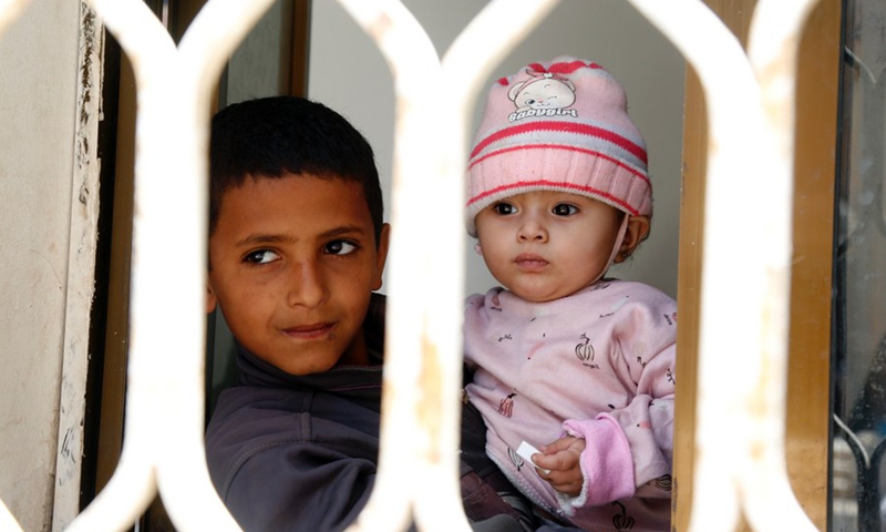 Two Yemeni children are seen inside their house in Sanaa, Yemen on May 30, 2021.(Photo: Xinhua)
