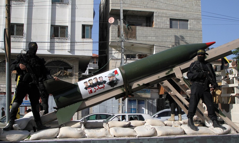 Members of Saraya al-Quds brigades stand guard on a truck with mounted rocket launchers during a parade in Gaza City, on May 29, 2021.(Photo: Xinhua)