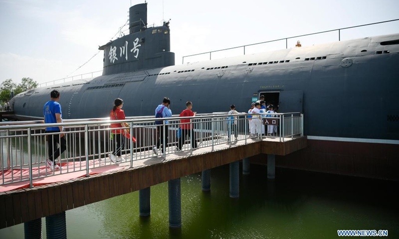 Fire fighters and their relatives visit a military culture park in Yinchuan, northwest China's Ningxia Hui Autonomous Region, May 30, 2021. Fire fighting department of Xingqing District in Yinchuan City on Sunday organized the visit for fire fighters and their children to greet the upcoming International Children's Day.(Photo: Xinhua)
