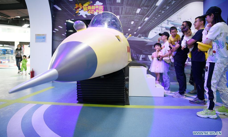 Fire fighters and their relatives visit a military culture park in Yinchuan, northwest China's Ningxia Hui Autonomous Region, May 30, 2021. Fire fighting department of Xingqing District in Yinchuan City on Sunday organized the visit for fire fighters and their children to greet the upcoming International Children's Day.(Photo: Xinhua)