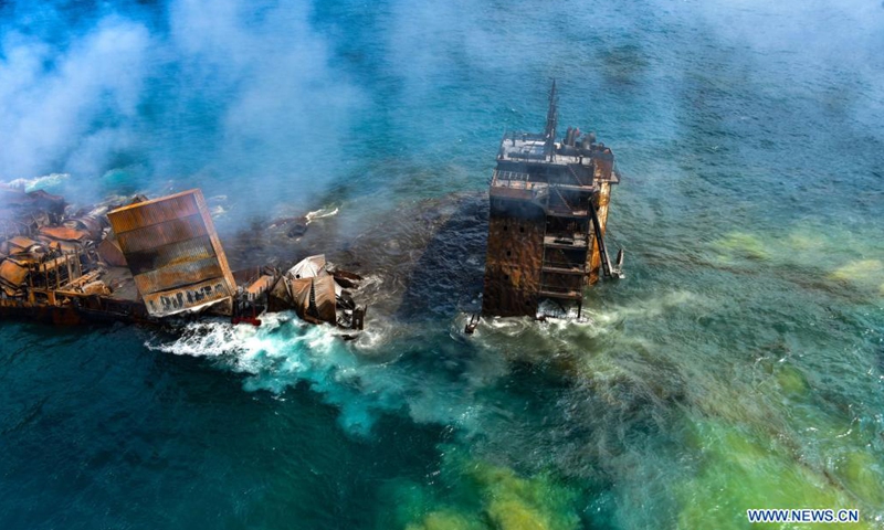 Photo taken on June 2, 2021 shows part of the X Press Pearl, a container ship burnt near the Colombo Port, in Colombo, Sri Lanka. The Sri Lankan Navy on Wednesday said that operations to tow the burnt X Press Pearl ship had been halted after the rear end of the vessel had hit the sea bed.(Photo: Xinhua)