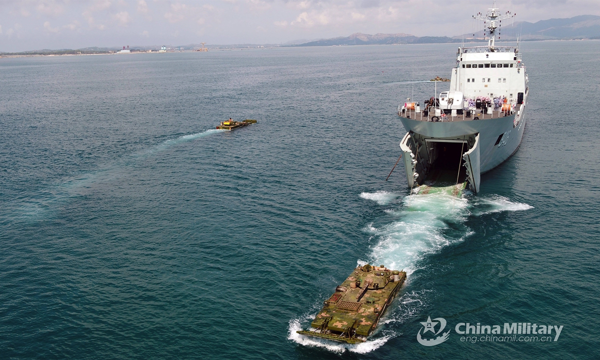 Two amphibious armored infantry fighting vehicles (IFVs) steer off the well deck of a landing ship and make their way into the sea during the several-week-long realistic combat training jointly conducted by a naval landing ship flotilla under the PLA Southern Theater Command and a combined arms brigade under the PLA 74th Group Army in mid-May, 2021. Photo: China Military Online