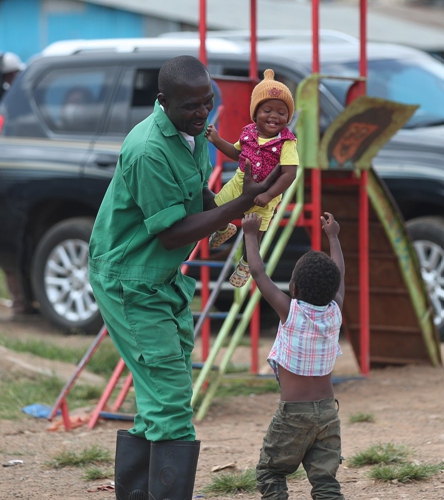 Fredrick Okinda plays with children after work on June 2, 2021. (Photo: Xinhua)