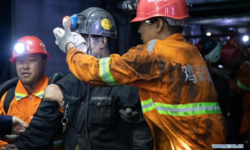 A trapped miner is lifted to the ground from the site of a coal mine accident in Jixi City of northeast China's Heilongjiang Province, June 6, 2021. All the eight miners trapped in a coal mine after a coal and gas outburst in Jixi City of northeast China's Heilongjiang Province have been lifted to the ground, rescuers said Sunday.(Photo: Xinhua)