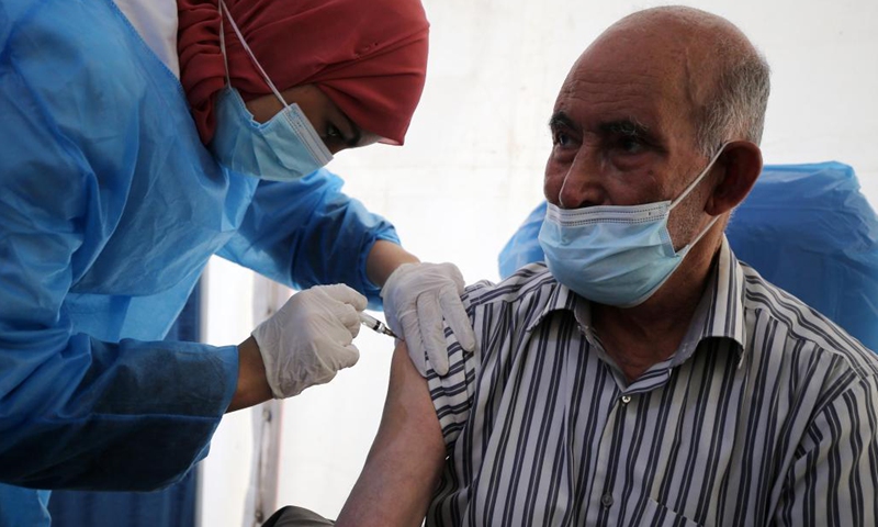 A man receives a dose of COVID-19 vaccine at a temporary vaccination station in Algiers, Algeria, June 6, 2021. Algeria began to set up temporary vaccination stations on Sunday to speed up vaccination against COVID-19 in the country.(Photo: Xinhua)