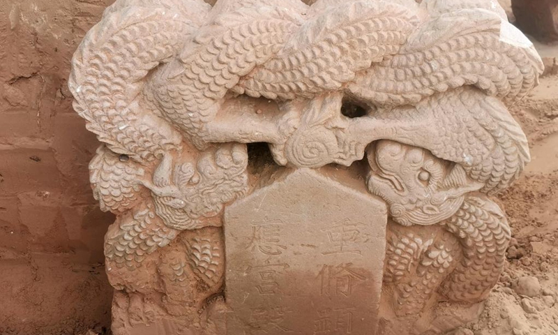 File photo taken on June 5, 2020 shows a stone tablet unearthed from the remains of the Qingpingbao castle, located in Jingbian County, Yulin City of northwest China's Shaanxi Province. The remains of a Great Wall castle dating back to the Ming Dynasty (1368-1644) were discovered in northwest China's Shaanxi Province, said the Shaanxi Academy of Archaeology Tuesday. Architectural relics, including two courtyards, were found at the remains of the Qingpingbao castle.(Photo: Xinhua)