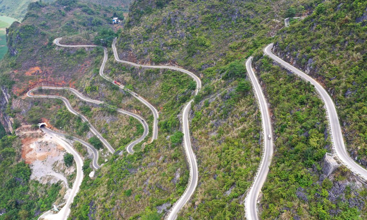 Aerial photo taken on April 16, 2020 shows a rural road winding through the mountains in Lingyun County, south China's Guangxi Zhuang Autonomous Region. (Xinhua/Zhou Hua)