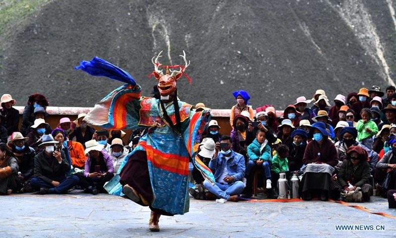 A Buddhist monk performs Cham dance at the Drigung Monastery in Lhasa, southwest China's Tibet Autonomous Region, June 9, 2021. Cham dance is a masked and costumed ritual performed by Tibetan Buddhist monks.Photo:Xinhua