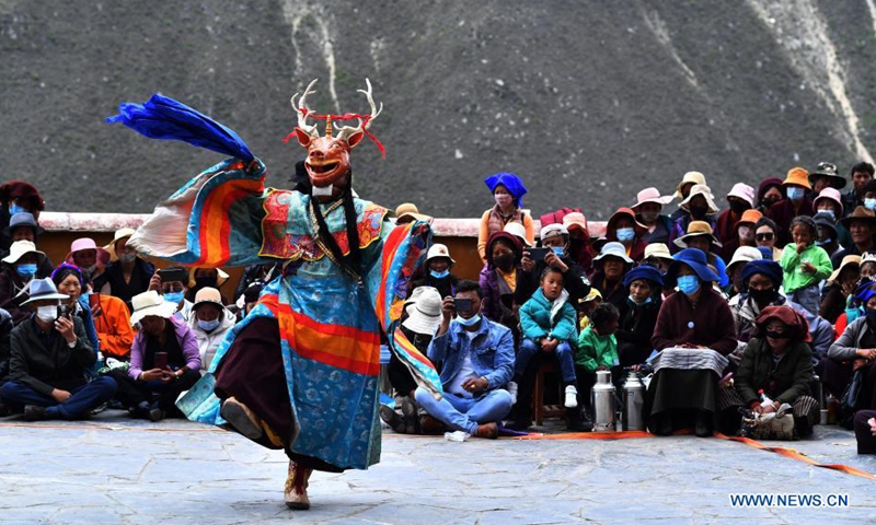 A Buddhist monk performs Cham dance at the Drigung Monastery in Lhasa, southwest China's Tibet Autonomous Region, June 9, 2021. Cham dance is a masked and costumed ritual performed by Tibetan Buddhist monks.   Photo: Xinhua
