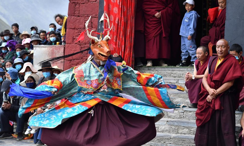 Buddhist monks perform Cham dance at the Drigung Monastery in Lhasa, southwest China's Tibet Autonomous Region, June 9, 2021. Cham dance is a masked and costumed ritual performed by Tibetan Buddhist monks.Photo:Xinhua