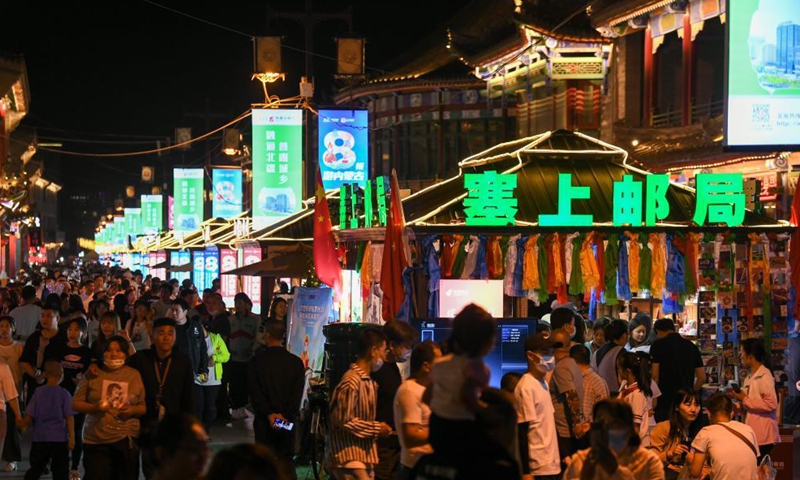 Tourists visit an old street in Hohhot, north China's Inner Mongolia Autonomous Region, June 10, 2021. Various activities such as appreciating traditional music and tasting local food are held here to promote tourism. Photo: Xinhua