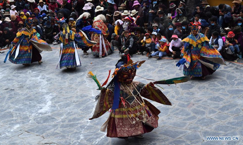 Buddhist monks perform Cham dance at the Drigung Monastery in Lhasa, southwest China's Tibet Autonomous Region, June 9, 2021. Cham dance is a masked and costumed ritual performed by Tibetan Buddhist monks.  Photo: Xinhua