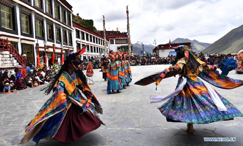Buddhist monks perform Cham dance at the Drigung Monastery in Lhasa, southwest China's Tibet Autonomous Region, June 9, 2021. Cham dance is a masked and costumed ritual performed by Tibetan Buddhist monks.  Photo: Xinhua