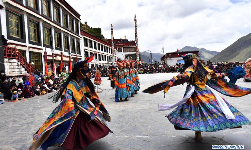 Buddhist monks perform Cham dance at the Drigung Monastery in Lhasa, southwest China's Tibet Autonomous Region, June 9, 2021. Cham dance is a masked and costumed ritual performed by Tibetan Buddhist monks.Photo:Xinhua