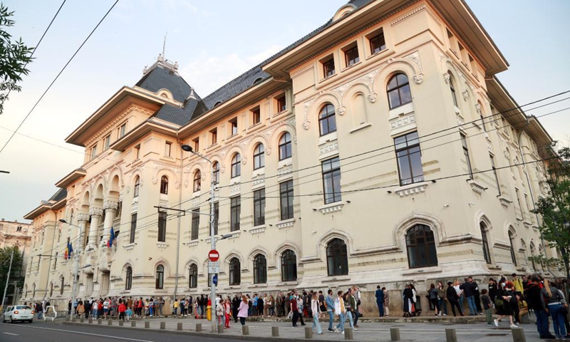 People queue to visit the Bucharest City Hall as part of the European Night of Museums cultural initiative in Bucharest, Romania, on June 12, 2021. (Photo by Gabriel Petrescu/Xinhua)